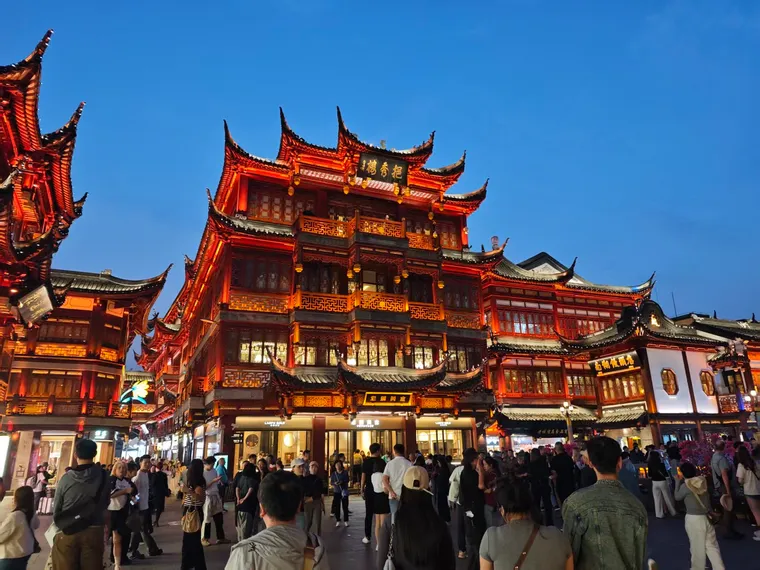 Yuyuan Bazaar: grey tiles and upswept eaves, rebuilt in the 1990s in Ming-and-Qing style